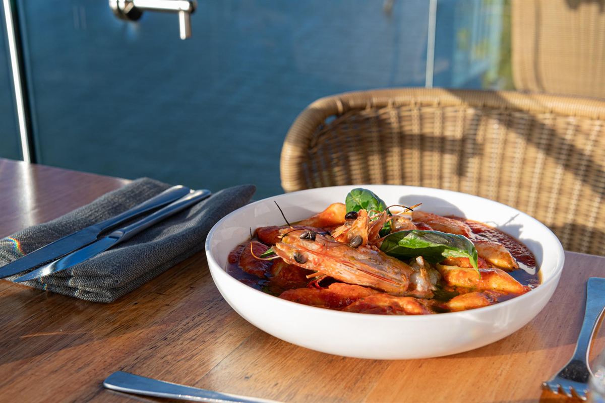 A seafood dish served on the deck, with the Burnett River behind