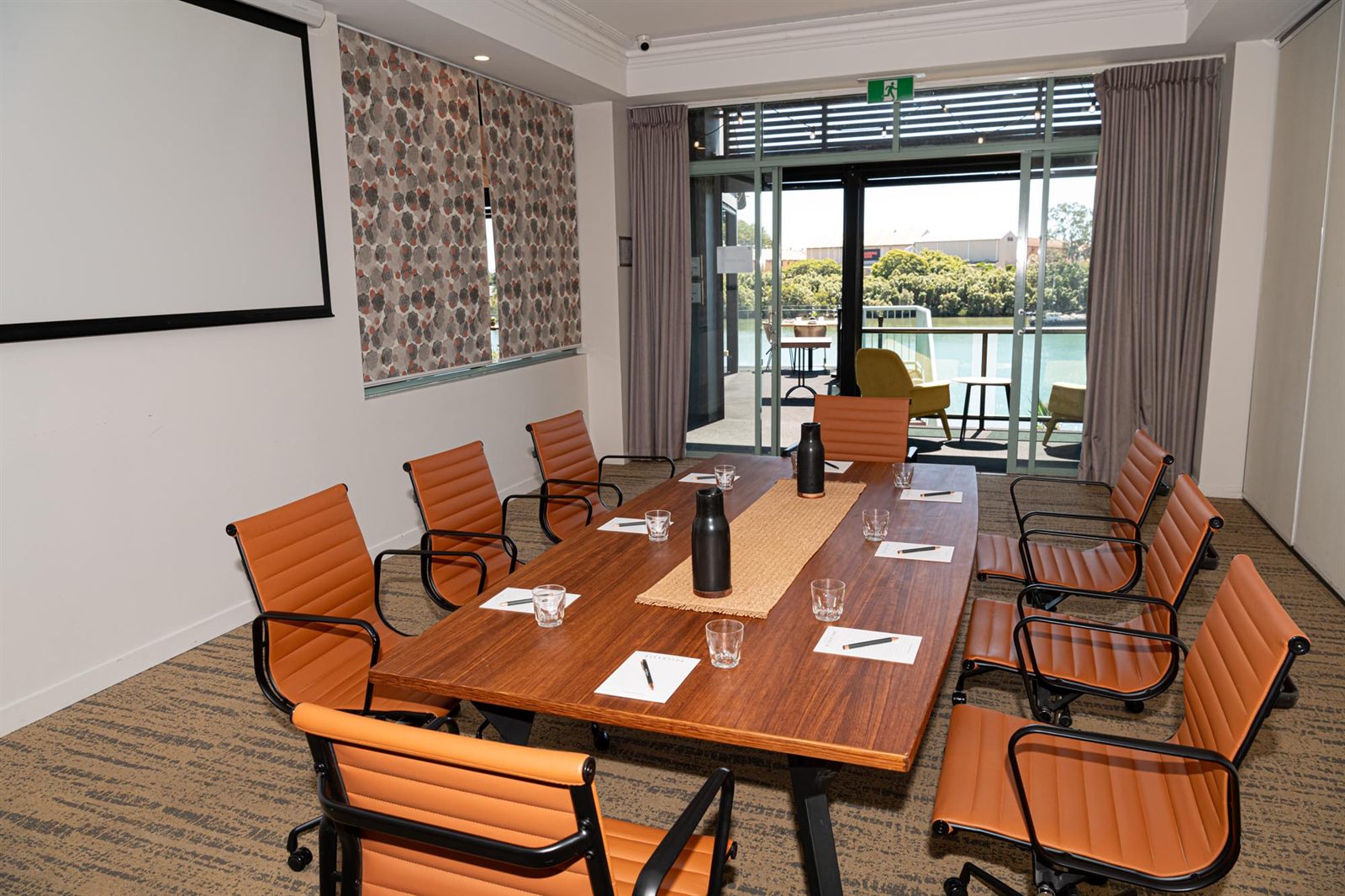 The Vue Room boardroom set for a meeting at Burnett Riverside Hotel